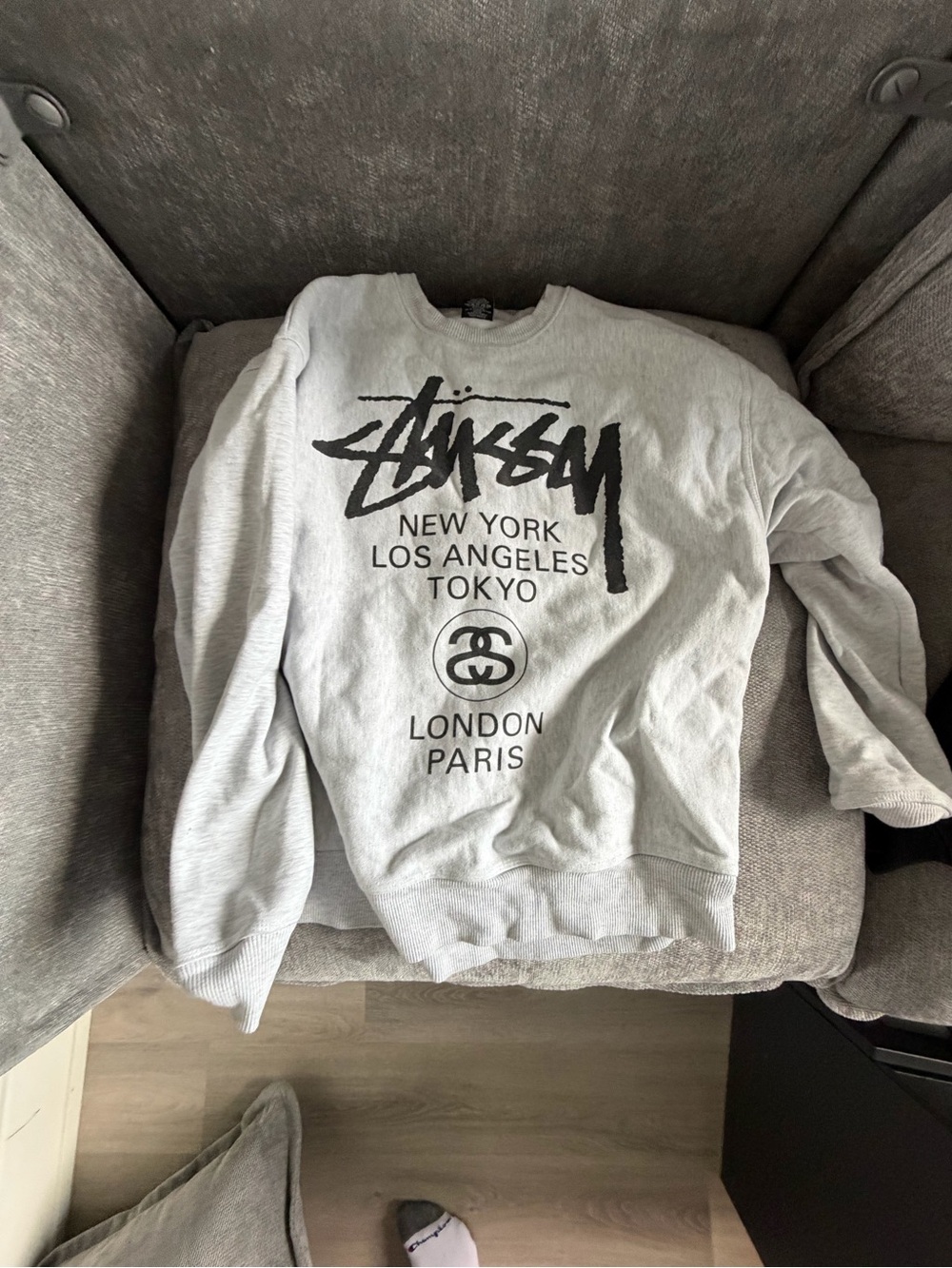 Stussy Men’s Light Gray Crewneck with Black Logo Cities Graphic
